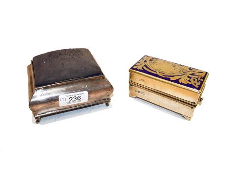 An Edward VII silver pin-cushion, by J. and R. Griffin, Chester, 1907, oblong and on four scroll feet, the hinged cover opens