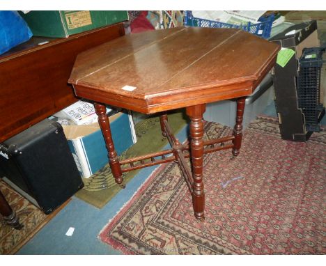 An Edwardian octagonal Mahogany occasional Table standing on turned legs with bobbin detailed cross stretcher, 30'' diameter 