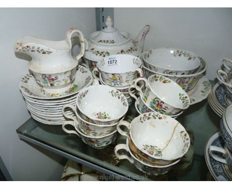 A Victorian Teaset with Chinese style decoration including twelve cups and saucers, teapot, etc. (some a/f).