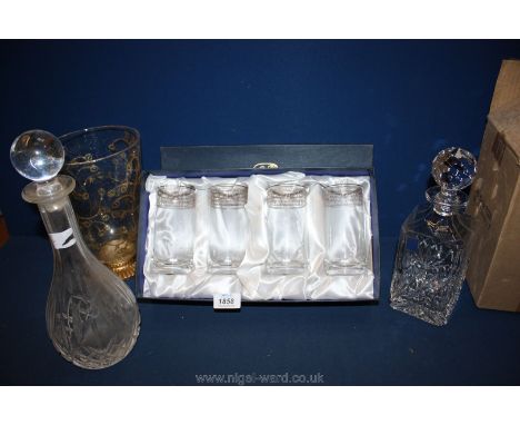 A heavy square shaped Royal Scot lead crystal Decanter and stopper and another decanter and stopper and a boxed set of four S