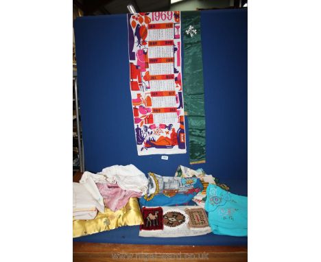 A quantity of vintage linen including wall hanging calendar by Liberty.