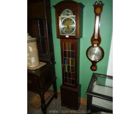 An Oak cased, lead glazed doored two train movement Longcase Clock having brass face and polished steel chapter ring and cast