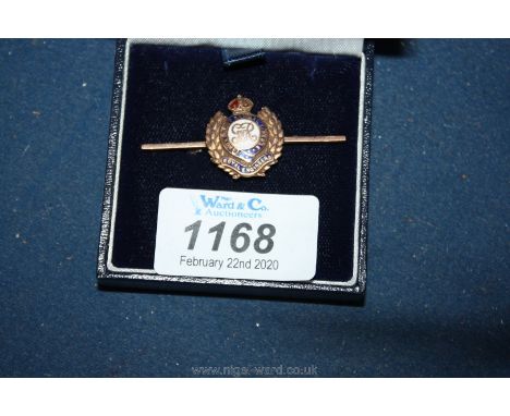 A 9ct gold and enamel 'Royal Engineers' brooch.