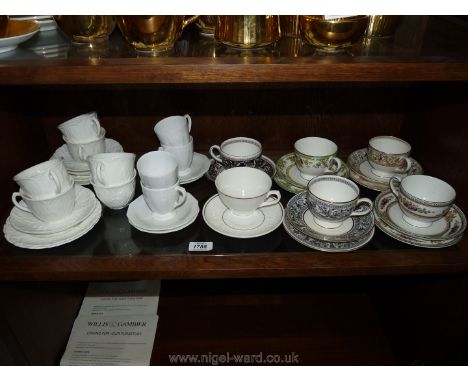 Four Wedgwood trios, two cups and saucers, four Spode white coffee cans, six Coalport cups, three saucers and four plates.