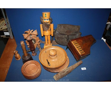 A box of treen including cuckoo clock, piano shaped manicure box a/f, nutcracker, and a leather bag initialed E.R.F.G.