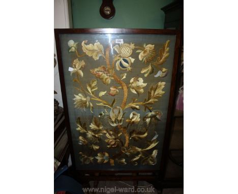 A Mahogany framed Firescreen, very nicely needle worked with stylised plants, 26'' wide x 50'' high