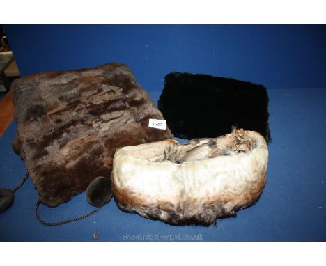 A vintage feather collar, fur muff and a fur stole.