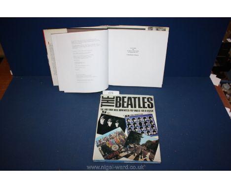 A first edition hardback copy of Beatles 64 ''A Hard Day's Night'' in America, 1989, plus another book.