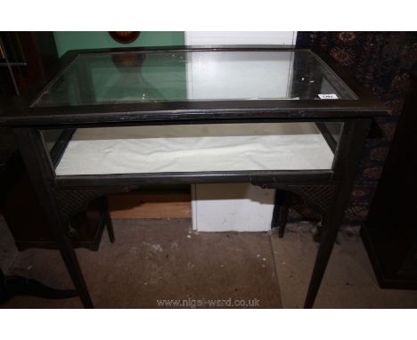 An ebonised framed trinket display Table standing on slender tapering square legs, 30 1/4'' x 18 1/4'' x 31'' high