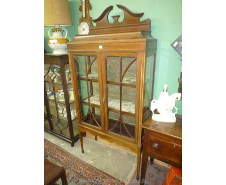 An Edwardian Mahogany light and darkwood strung china Display Cabinet standing on tapering square legs terminating in spade f