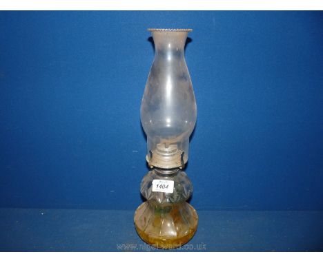 A glass oil lamp.
