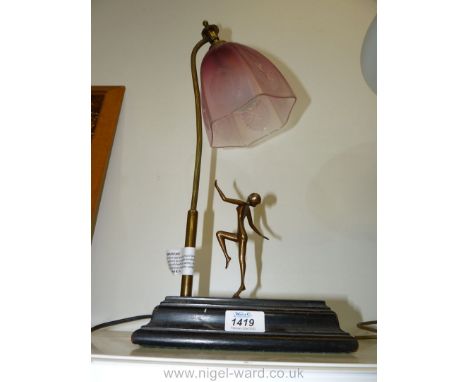 An art deco style electric Lamp with cranberry shade.