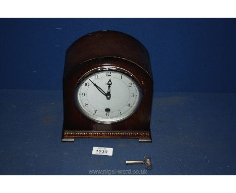 A 1930's Oak mantle Clock with key.