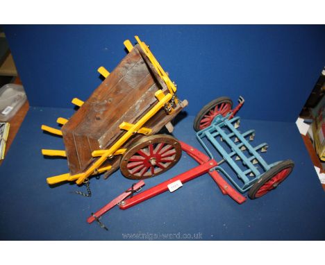 Two farm related toys - a toy scuttle and a cart to go on a large toy tractor.