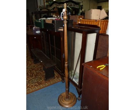 A turned darkwood Standard Lamp
