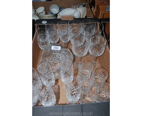 A quantity of matched glasses, red, white and sparkling wine, whisky glasses, cut glass basket etc.