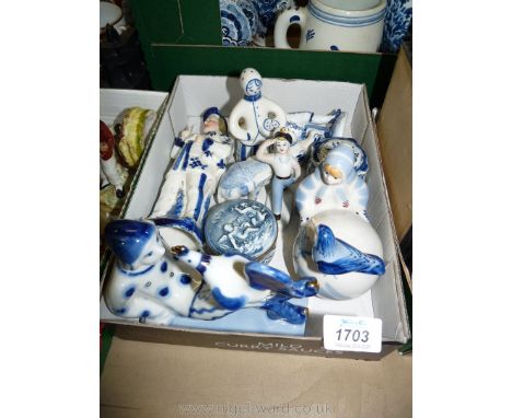 A quantity of blue and white Gzhel porcelain figures including elephant, lady with chickens and two trinket pots with lids.