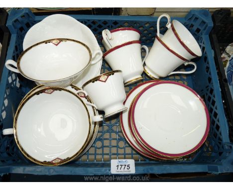 A set of four Minton cups, saucers and side plates with red/gold border, two Spode soup bowls, five side plates and four whit