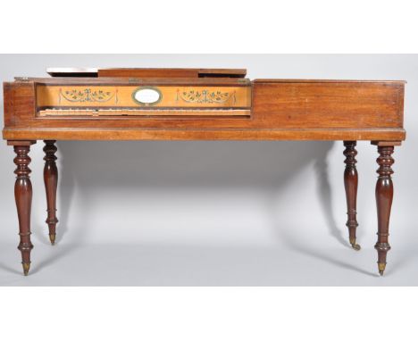 A George III mahogany square piano on turned legs, the top opening to reveal a painted satinwood panel and enamel makers plaq