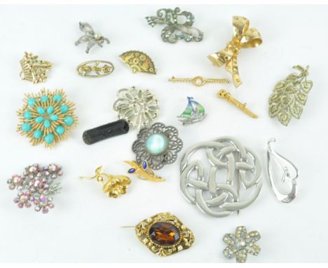 A collection of twenty costume brooches, of varying design to include a pewter Celtic brooch