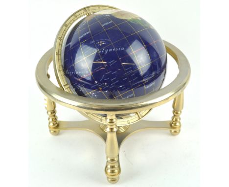 A 20th century table globe, inlaid with hardstones and shells, 32cm high