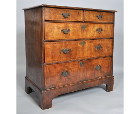 A George III walnut chest of two short and three long drawers, on bracket feet, 95cm high x 92cm wide x 51cm deep