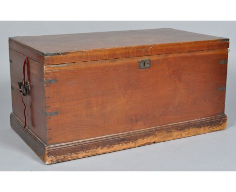 A 20th Century antique oak shipping trunk / chest having brass bound corners, brass lockplate, campaign handles. The trunk be