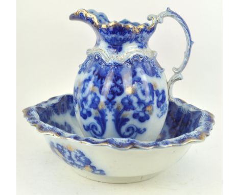 A 19th century Ford &amp; Sons Ltd pottery wash jug and basin, printed in flow blue and gilt with flowers, printed factory ma