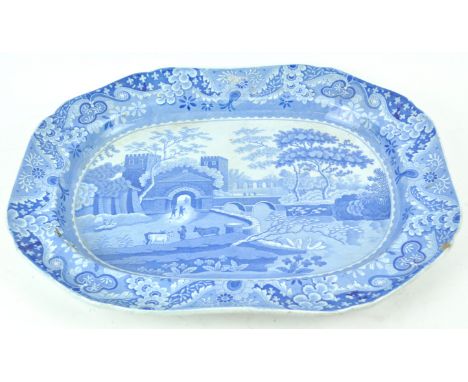A 19th century Spode pottery meat plate, printed in blue with figures, cattle and swans in a river landscape with buildings b