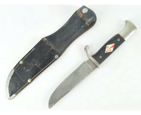 A post WWII Second World War German M7/13 pattern dagger having a chequered grip with scouts emblem, hooked pommel, rear faci