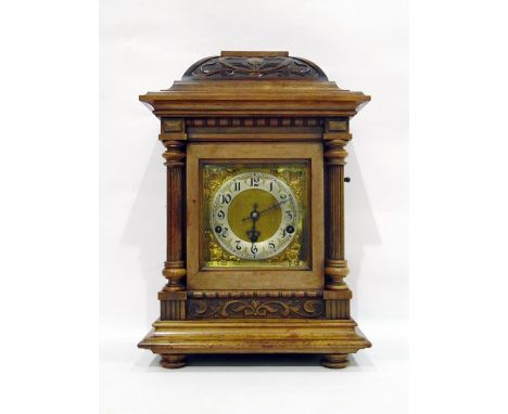 Late 19th century carved walnut cased German mantel clock with silvered chapter ring, striking and chiming movement, with ree