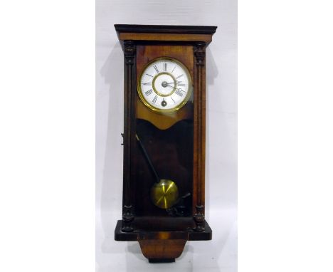 Late 19th century walnut cased wall clock with enamel dial and Roman numerals, glazed door and visible pendulum, height 40cm 