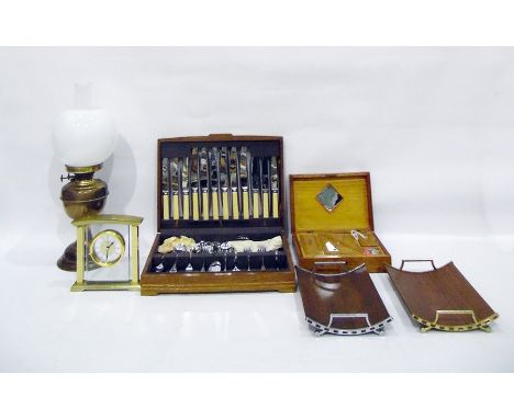 Marquetry inlaid sewing box, two fruit trays, a turned wood nutcracker, travel Scrabble, table lighters, part canteen of cutl