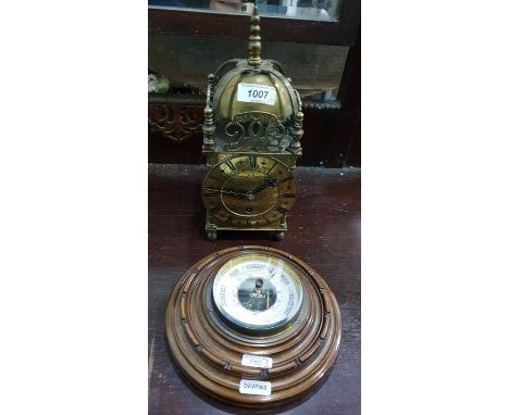 Reproduction brass lantern clock on ball feet and an aneroid barometer in a circular wooden case (2) 