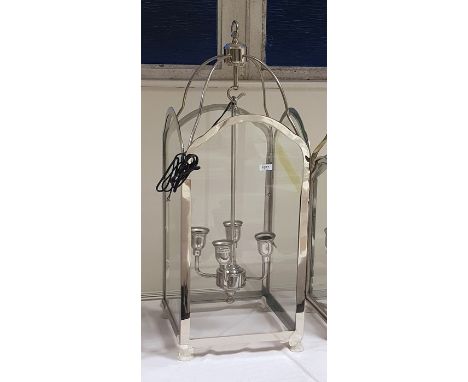 Four-branch hanging lantern within a glazed steel frame, height 85cm (VAT payable on hammer) 