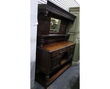 19th century Jacobean revival carved oak mirror back sideboard, the frieze with lunette carving, the bevelled mirror flanked 