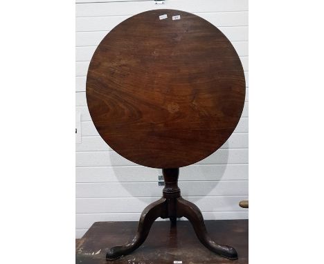 Early 19th century mahogany circular tilt-top tripod table, having turned column and outswept tripod supports, 76cm diameter 