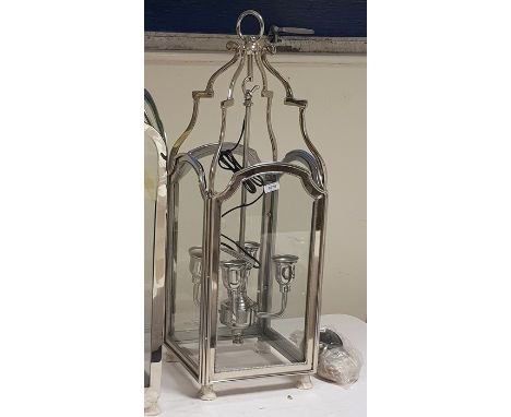 Four-branch hanging lantern within a glazed steel frame, height 85cm (VAT payable on hammer) 