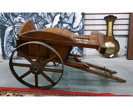 A wooden vintage&nbsp; dog cart,&nbsp; 60cms in length including the shafts