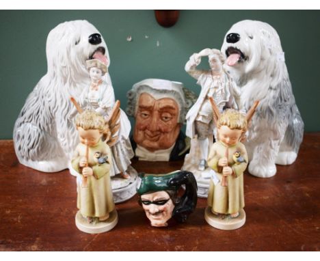 A PAIR OF HUMMEL FIGURES, musical angels; together with a pair of large Beswick figures of old English sheep dogs, 12" (31cm)