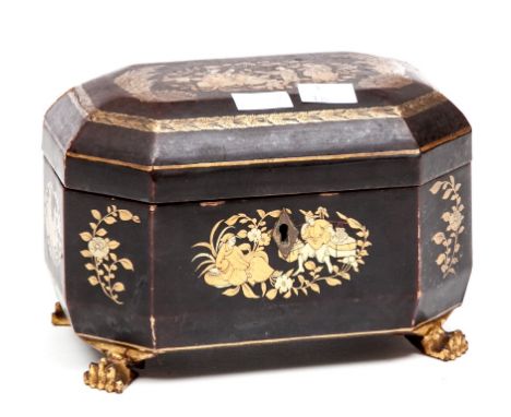 AN OCTAGONAL CHINESE LACQUERED PAPIER-MACHE TEA CADDY, of casket form, the hinged cover enclosing two pewter lidded canisters