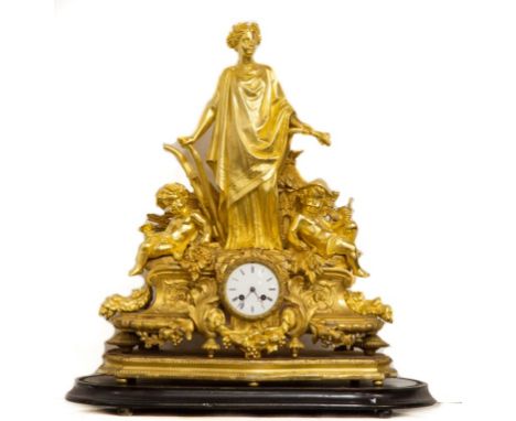 A FINE LATE 19TH CENTURY FRENCH GILT METAL MANTEL CLOCK, the case stamped PH. Mourey, the French movement striking on a steel