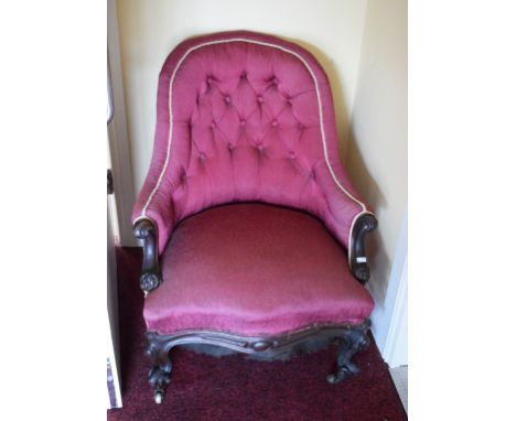 A VICTORIAN WALNUT TUB ARMCHAIR, with arched button back and serpentine-fronted seat, covered in wine fabric, raised on front