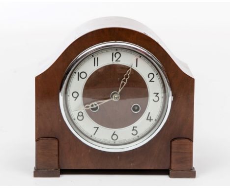 A BENTIMA MANTEL CLOCK, c.1950, with circular banded chromium dial, with Arabic numerals, striking on a steel gong, 9" (23cm)