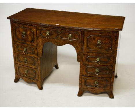 A FINE BOW-FRONTED BIRDS EYE MAPLE PEDESTAL SIDEBOARD, the reeded top above a central frieze drawer flanked to either side wi