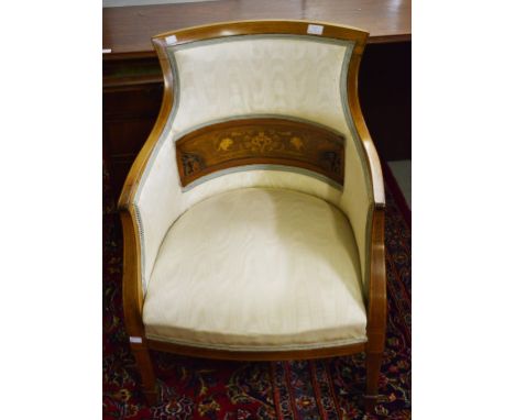 AN EDWARDIAN INLAID ROSEWOOD ARMCHAIR, the padded back with a centre concave marquetry inlaid panel, above a bow-fronted seat