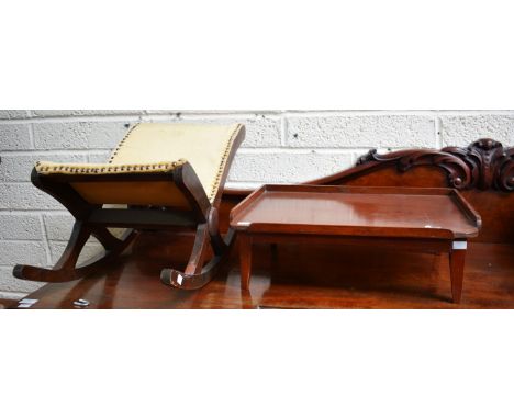 A RECTANGULAR POLISHED WOODEN BED TRAY, on four legs; together with an X-framed gout stool. (2)