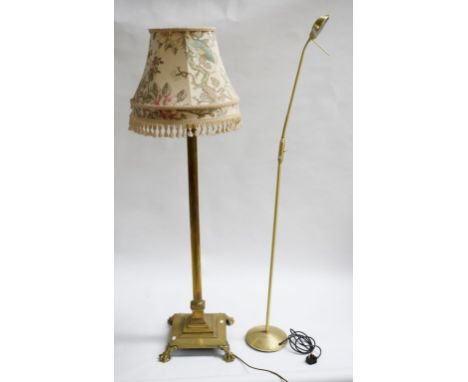 A HEAVY BRASS STANDARD LAMP, with reeded column and corinthian capital, raised on square stepped base with four ball and claw