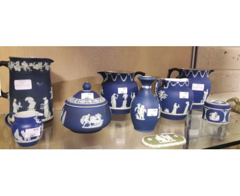 A COLLECTION OF MISCELLANEOUS BLUE AND WHITE WEDGWOOD JASPERWARE, comprising five assorted jugs of various sizes; a sugar bow