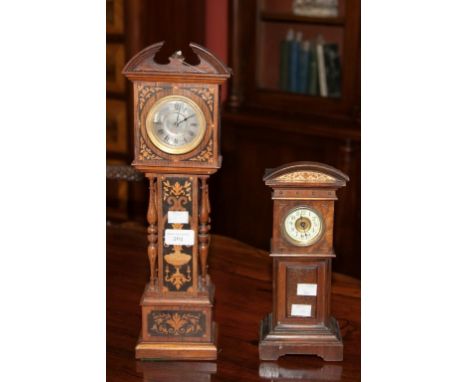 A FINE QUALITY MINIATURE ROSEWOOD AND FLORAL MARQUETRY LONGCASE CLOCK, with divided pediment above a circular silverised dial